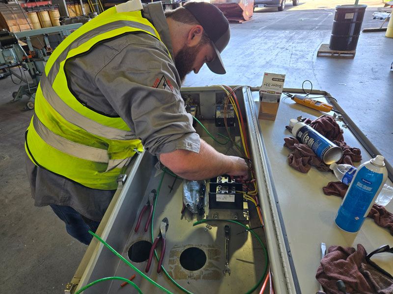 An ESR mechanic working on electrical components